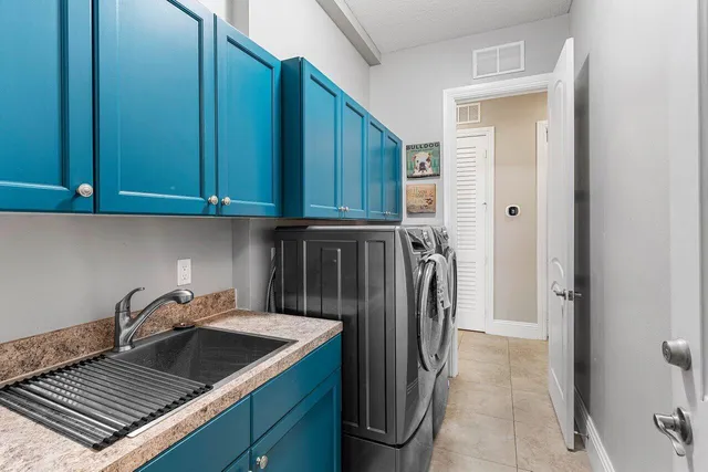 a kitchen with a sink and refrigerator