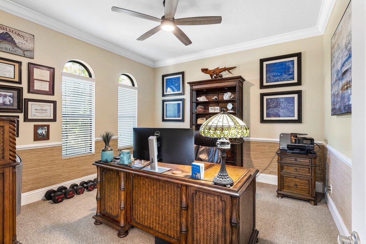 183 Calmo Circle Port St. Lucie, FL 34984 - Photo 27 of 38 a room with furniture and chandelier