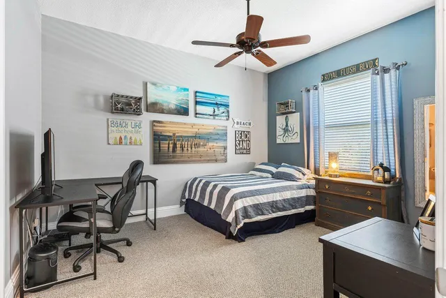 a bedroom with furniture and a window