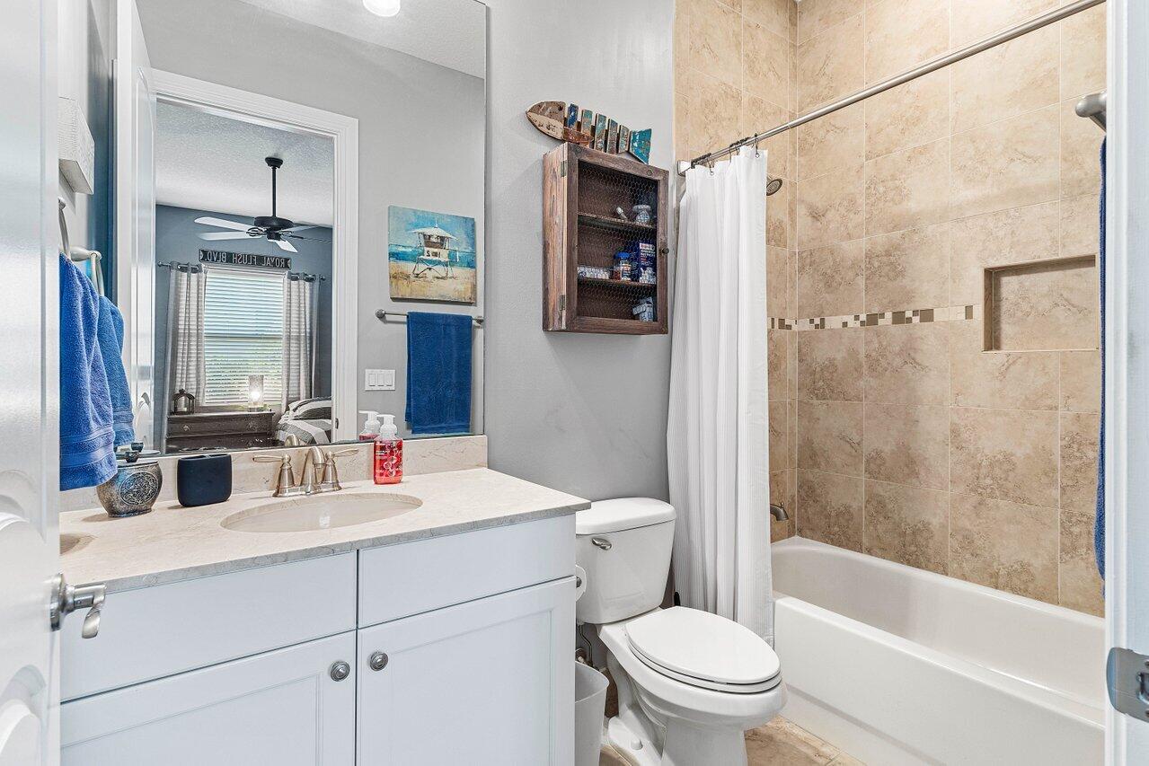 183 Calmo Circle Port St. Lucie, FL 34984 - Photo 29 of 38 a bathroom with a sink toilet and shower