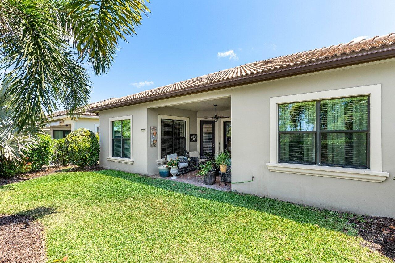 183 Calmo Circle Port St. Lucie, FL 34984 - Photo 32 of 38 a view of an house with backyard space and garden