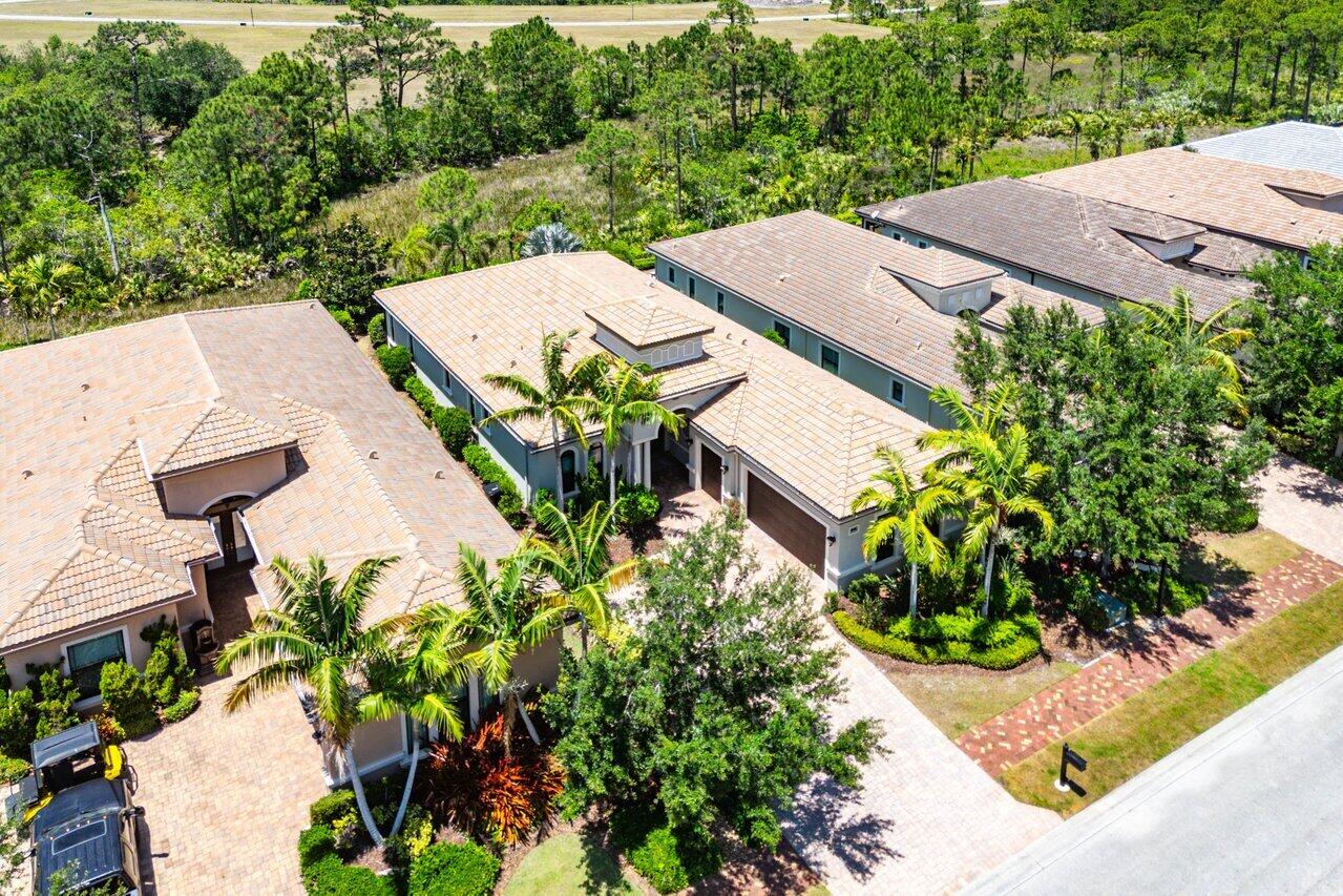 183 Calmo Circle Port St. Lucie, FL 34984 - Photo 35 of 38 an aerial view of a house with yard and mountain view in back