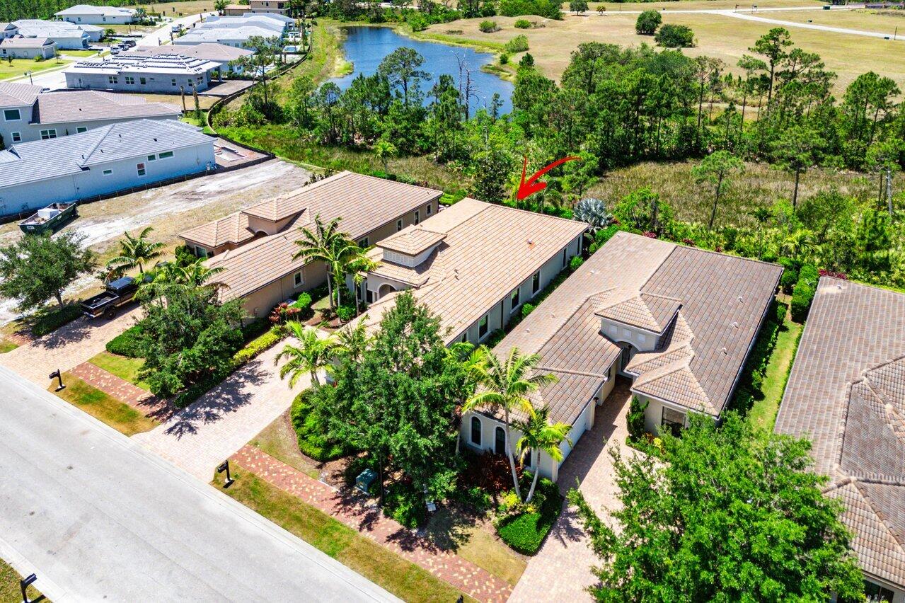 183 Calmo Circle Port St. Lucie, FL 34984 - Photo 37 of 38 an aerial view of a house with garden space and street view