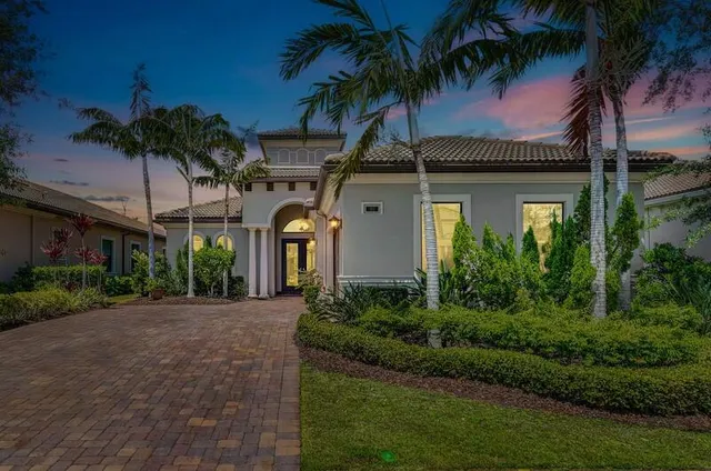 a front view of house with yard and green space