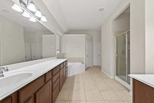 a bathroom with a sink a vanity and a mirror