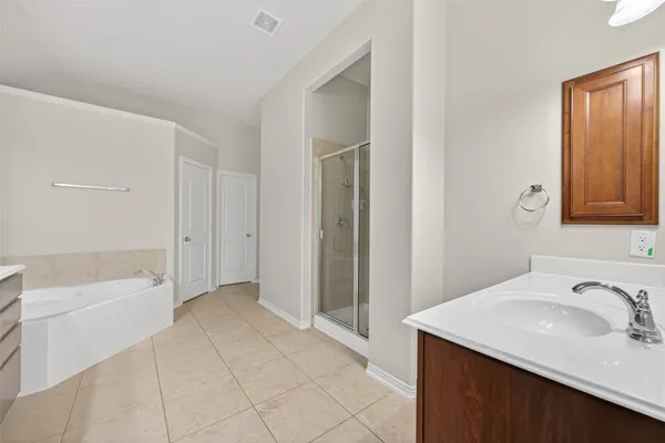 a bathroom with a sink a mirror and a bathtub