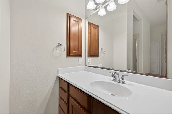 a bathroom with a sink and a mirror