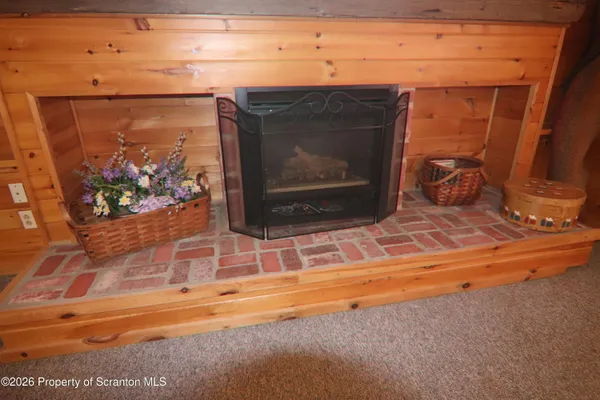 a view of an empty room and a window
