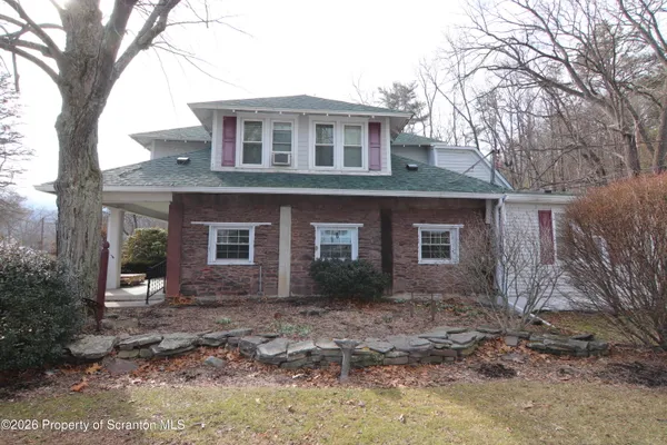 a room with wooden floor and furniture