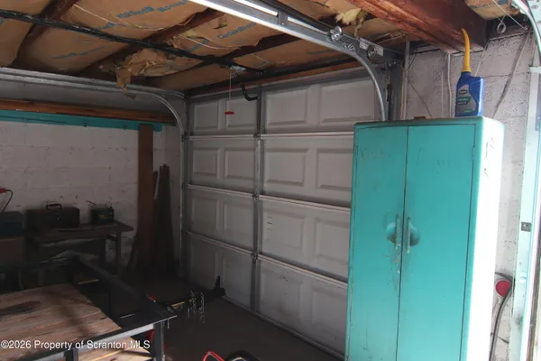 a view of a kitchen with furniture and a kitchen