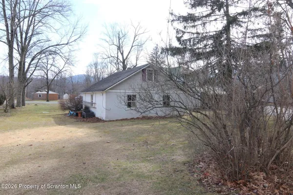 a brick building with a trees