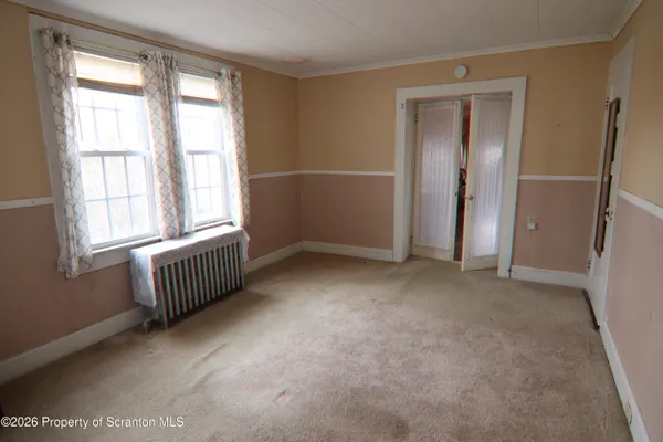 an empty room with windows