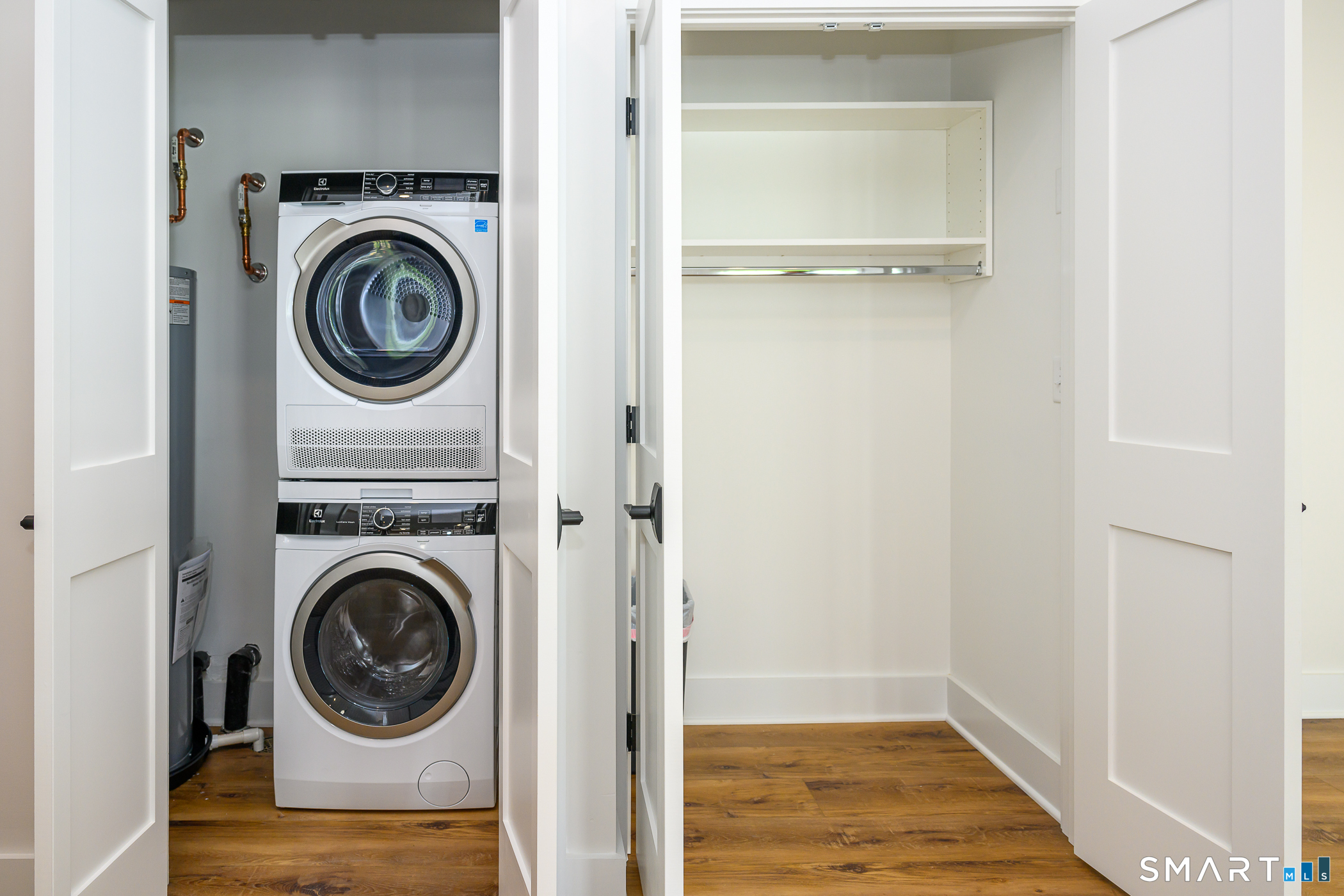 138 Boston Post Road, Unit 2 East Lyme, CT 06333 - Photo 3 of 30 1st floor laundry and coat closet.