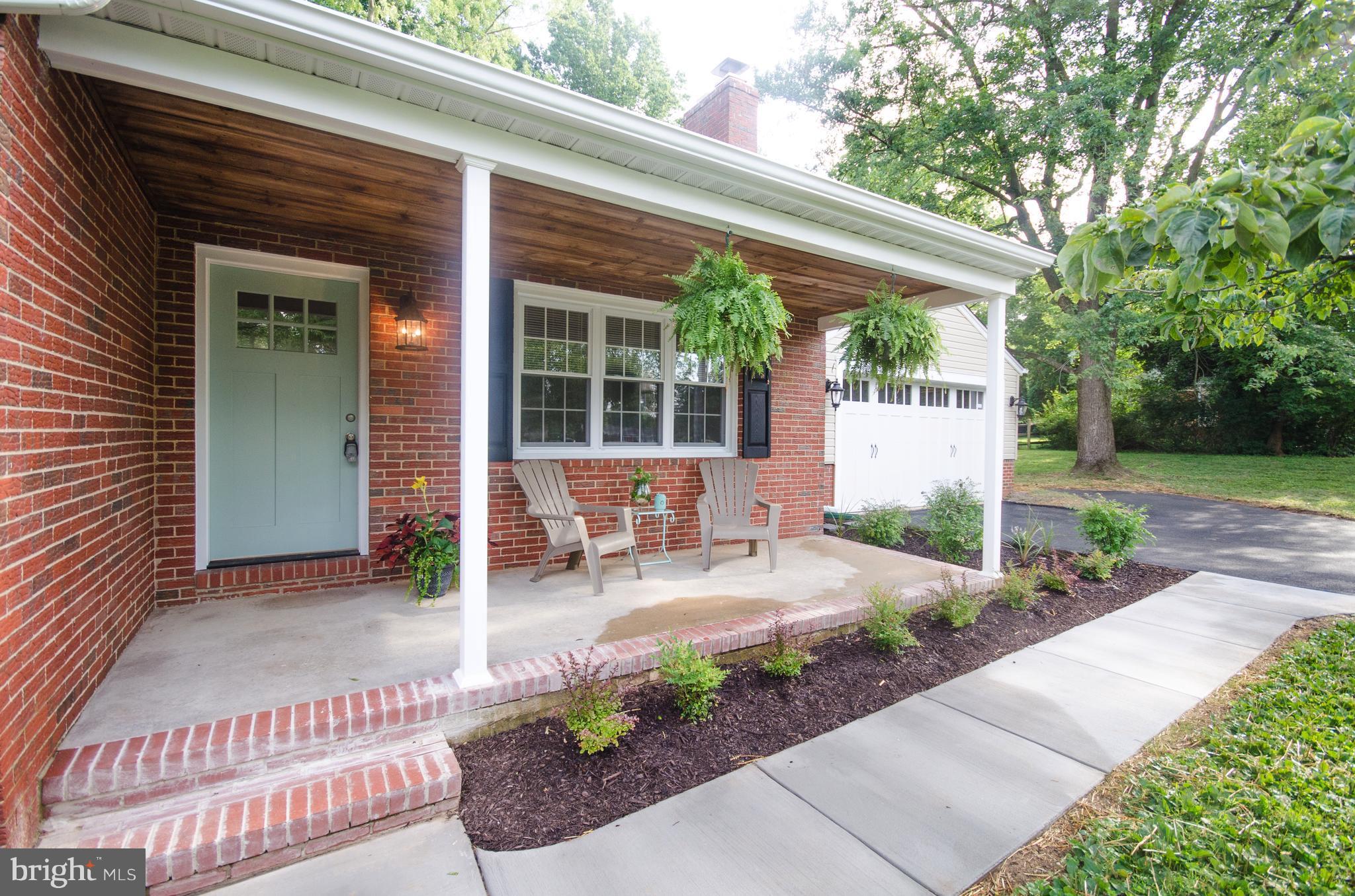 1007 Roxleigh Road Baltimore, MD 21286 - Photo 3 of 29 a backyard of a house with outdoor seating and green space