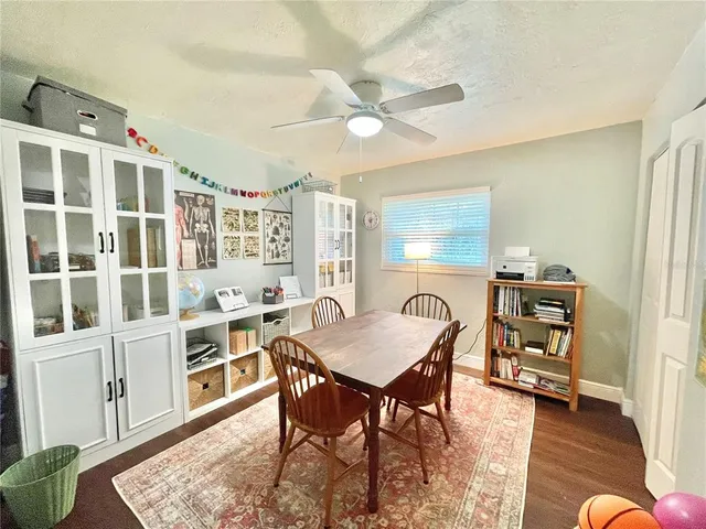 a dining room with furniture and window
