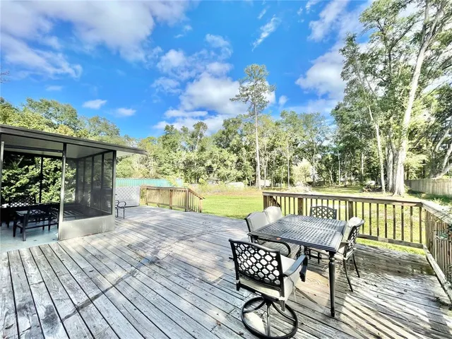 a view of a chairs and table on the wooden floor