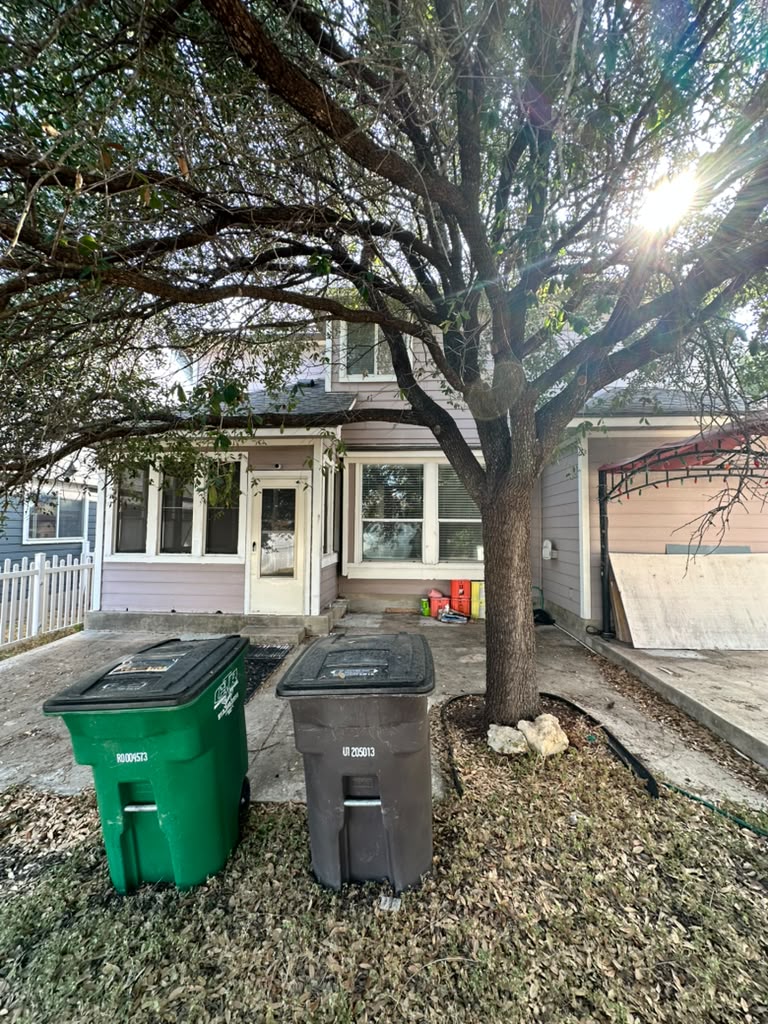 1981 Prairie Rock Way Round Rock, TX 78664 - Photo 22 of 22 Mature trees shade the concrete patio area behind the multi-level home.