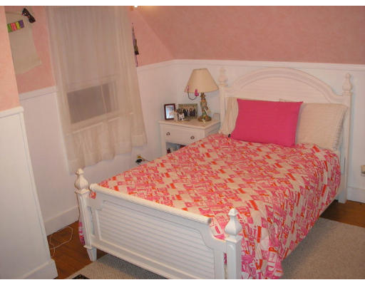 2 Bellvista Road Worcester, MA 01602 - Photo 10 of 11 a bed sitting in a bedroom next to a window