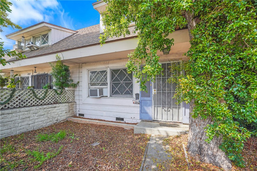 11667 Burbank Boulevard North Hollywood, CA 91601 - Photo 11 of 15 a front view of a house with a garden