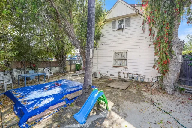 a view of a backyard with sitting area