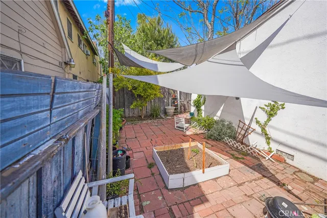 a view of a backyard with sitting area