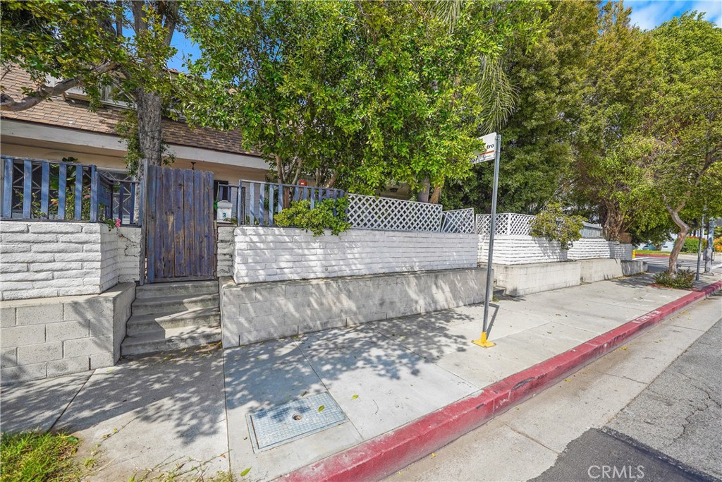 11667 Burbank Boulevard North Hollywood, CA 91601 - Photo 9 of 15 a view of a house with a tree