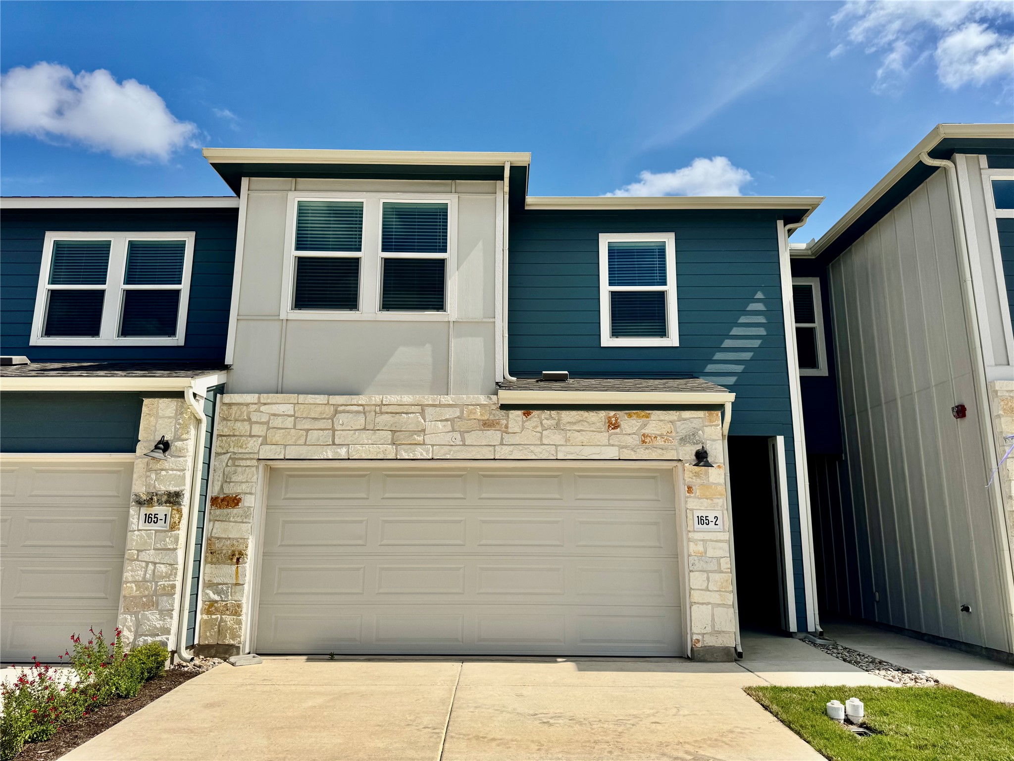 165 Calcite Road, Unit 2 Kyle, TX 78640 - Photo 1 of 17 a view of building with door