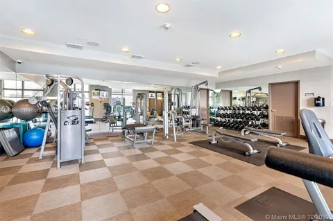 a living room with lots of furniture and a table