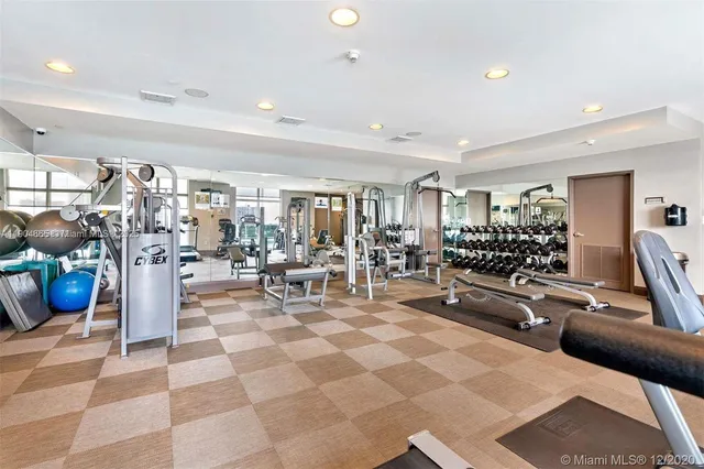 a living room with lots of furniture and a table