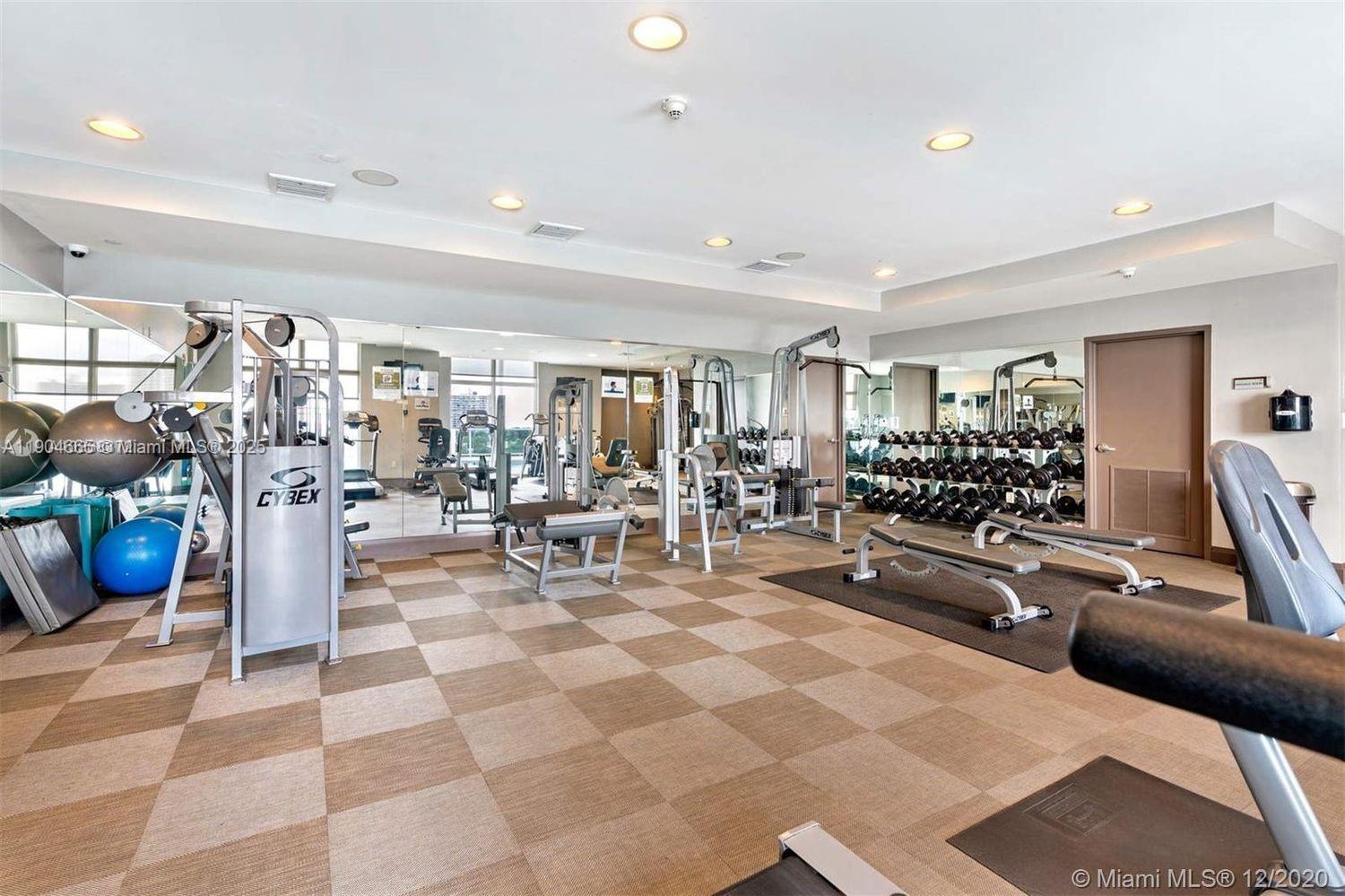 2525 Southwest 3rd Avenue, Unit 605 Miami, FL 33129 - Photo 11 of 19 a living room with lots of furniture and a table