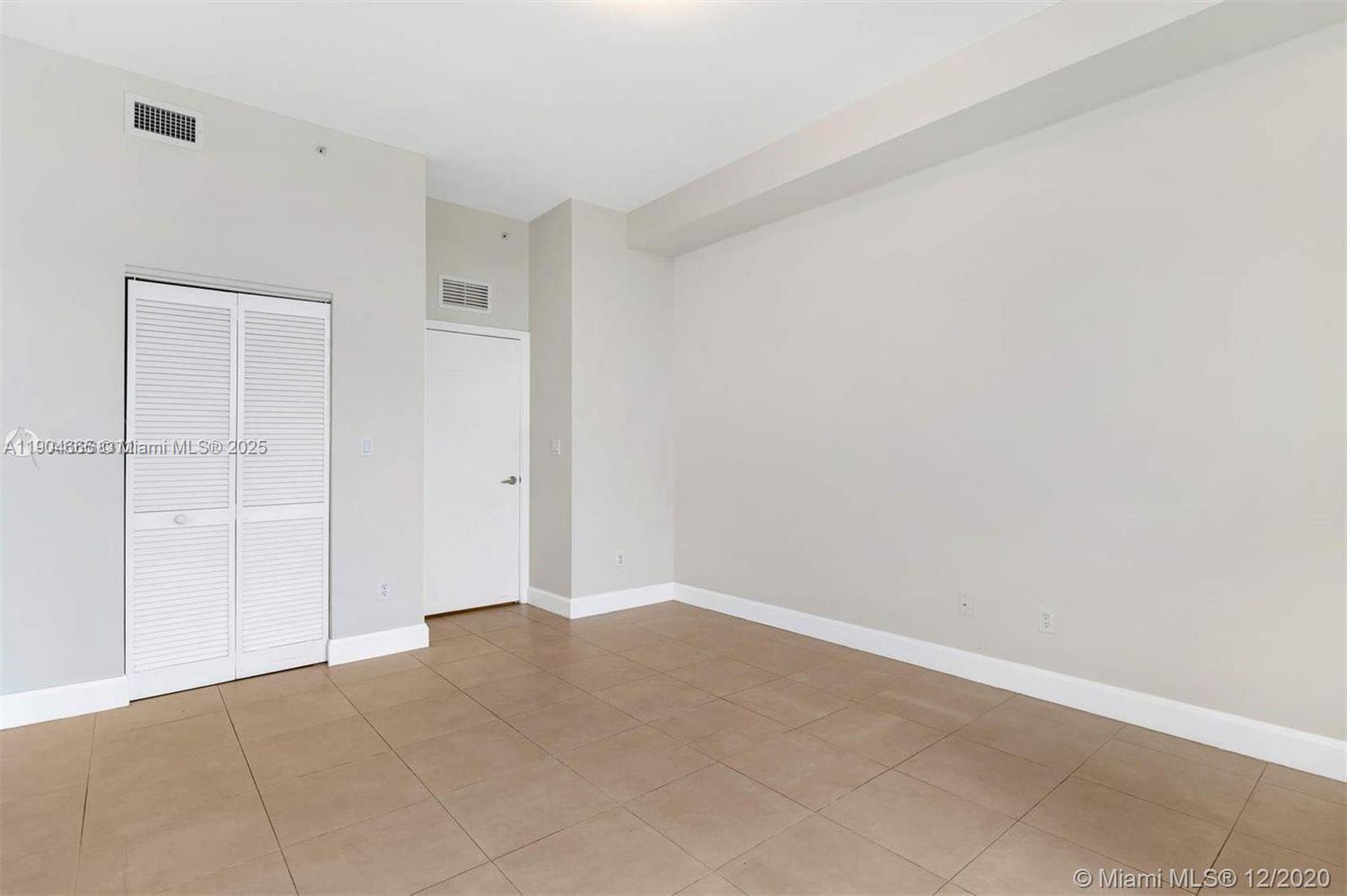 2525 Southwest 3rd Avenue, Unit 605 Miami, FL 33129 - Photo 13 of 19 an empty room with an entryway