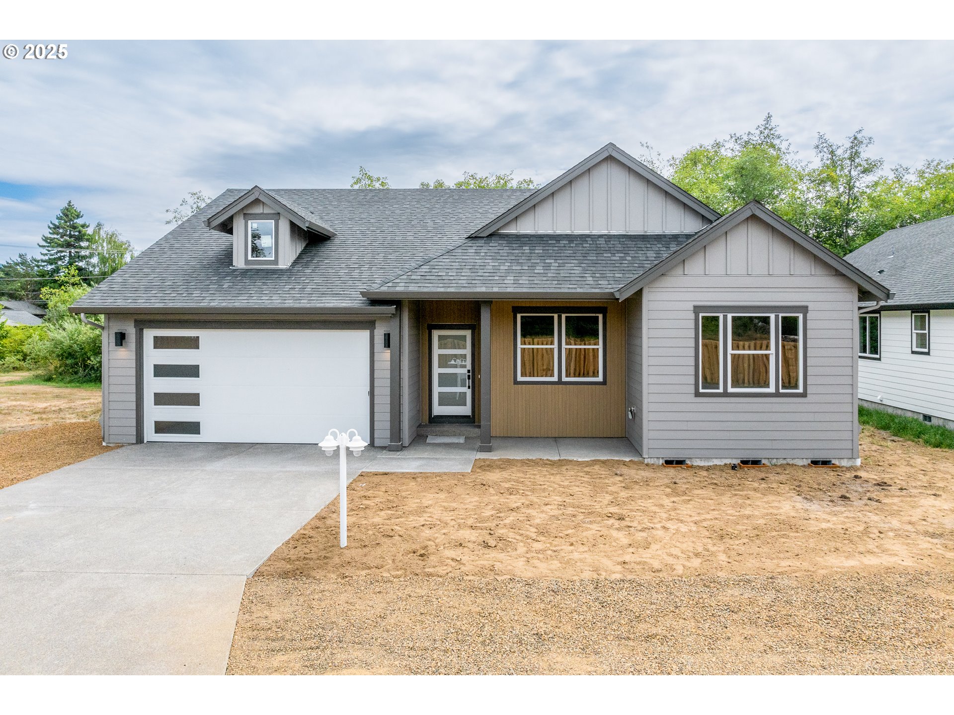 a house with yard in front of it