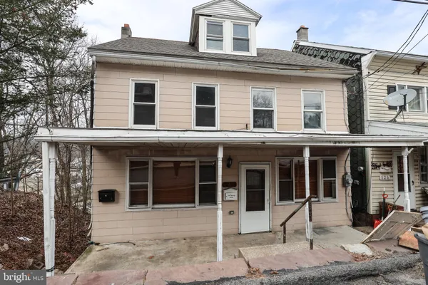 a front view of a house with a porch