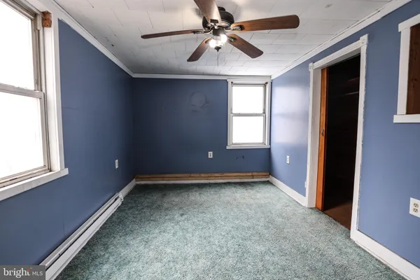 a view of a livingroom with an empty space and window