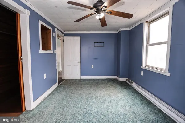 a bathroom with a shower and toilet