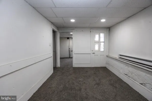 a view of an empty room with closet