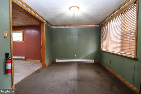 a view of gallery with wooden floor