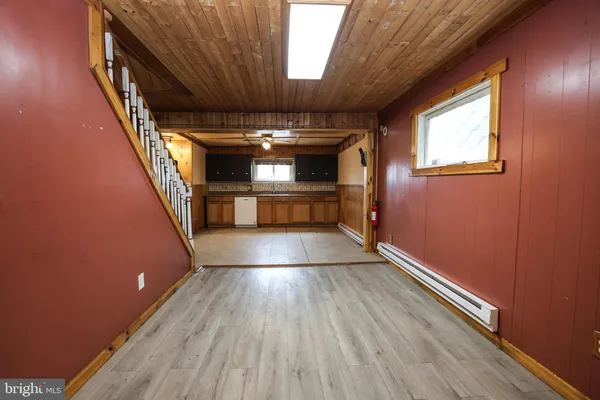 a kitchen with stainless steel appliances granite countertop a sink and a refrigerator