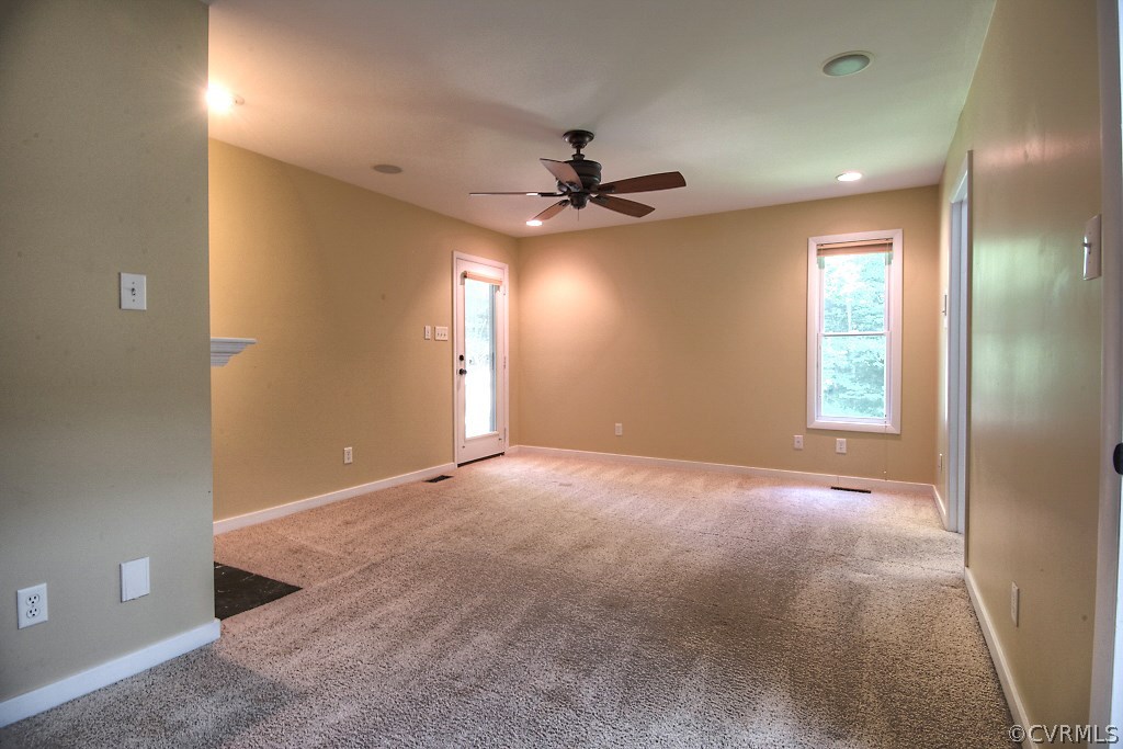3010 Long Oaks Road Midlothian, VA 23112 - Photo 14 of 30 an empty room with windows and fan