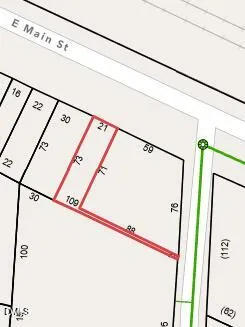 a view of a refrigerator with white walls