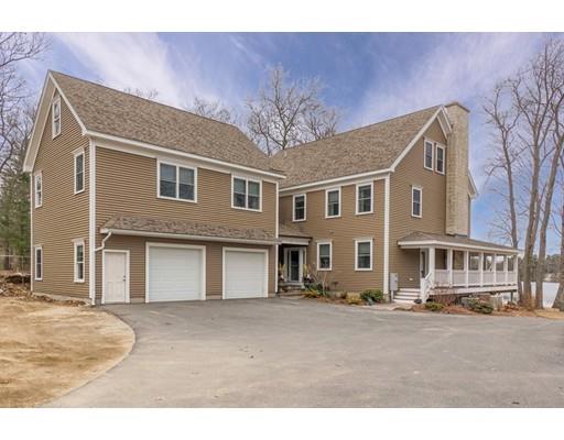 31 Round Road Lunenburg, MA 01462 - Photo 5 of 30 a front view of a building with a garden