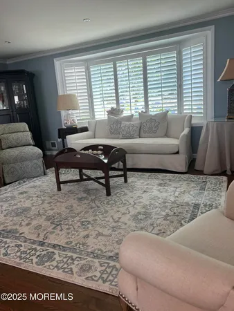 a living room with furniture and a rug