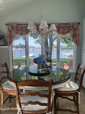 a dining room with furniture and window
