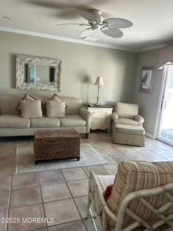 a living room with furniture and a mirror