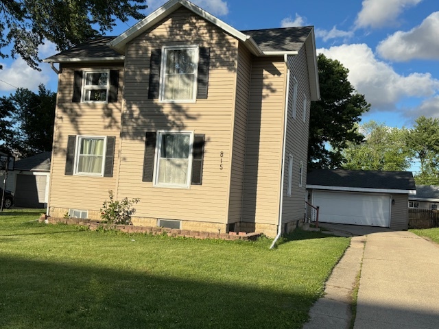 815 North 2nd Street Rochelle, IL 61068 - Photo 2 of 52 a front view of a house with a yard