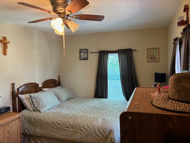 815 North 2nd Street Rochelle, IL 61068 - Photo 37 of 52 a bedroom with a bed and a chandelier