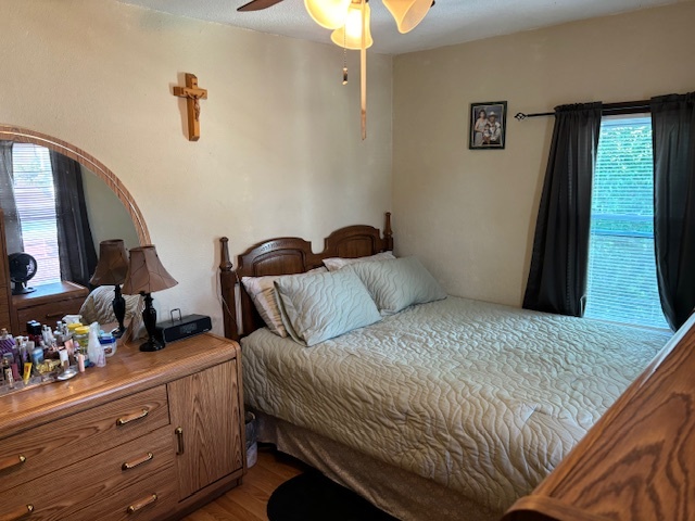 815 North 2nd Street Rochelle, IL 61068 - Photo 39 of 52 a bedroom with a bed and a chandelier
