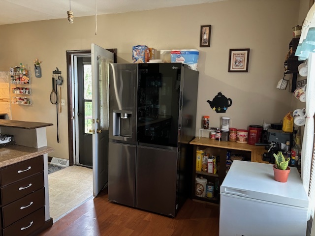 815 North 2nd Street Rochelle, IL 61068 - Photo 6 of 52 a kitchen with a refrigerator and cabinets