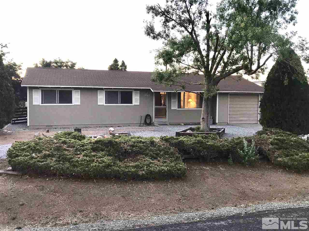 9285 Fremont Way Reno, NV 89506 - Photo 1 of 21 a front view of house with yard and green space