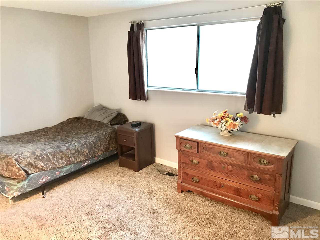 9285 Fremont Way Reno, NV 89506 - Photo 14 of 21 a bedroom with a bed and a window